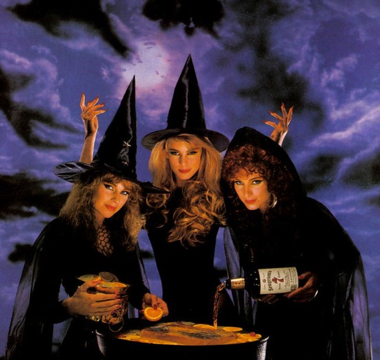 Three Witches casting spells around a cauldron 