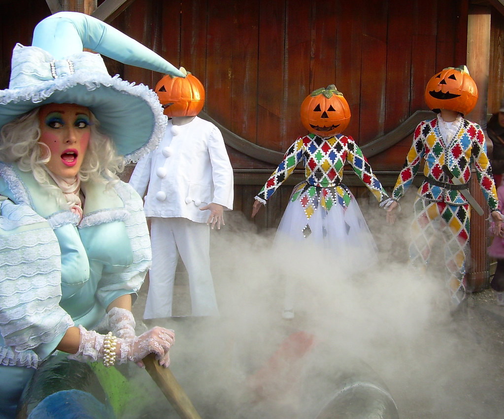 A Witch is looking fabulous as they kidnapped some pumpkin scarecrows